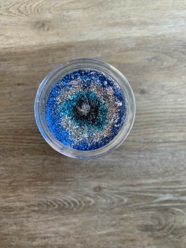 Blue and silver glitter in a jar.