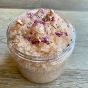 Pink Himalayan salt scrub with rose petals.