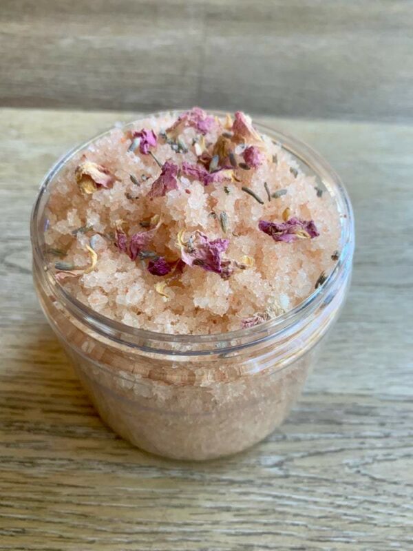 Pink Himalayan salt scrub with rose petals.