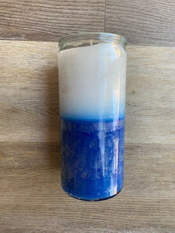 Blue and white glass jar candle.