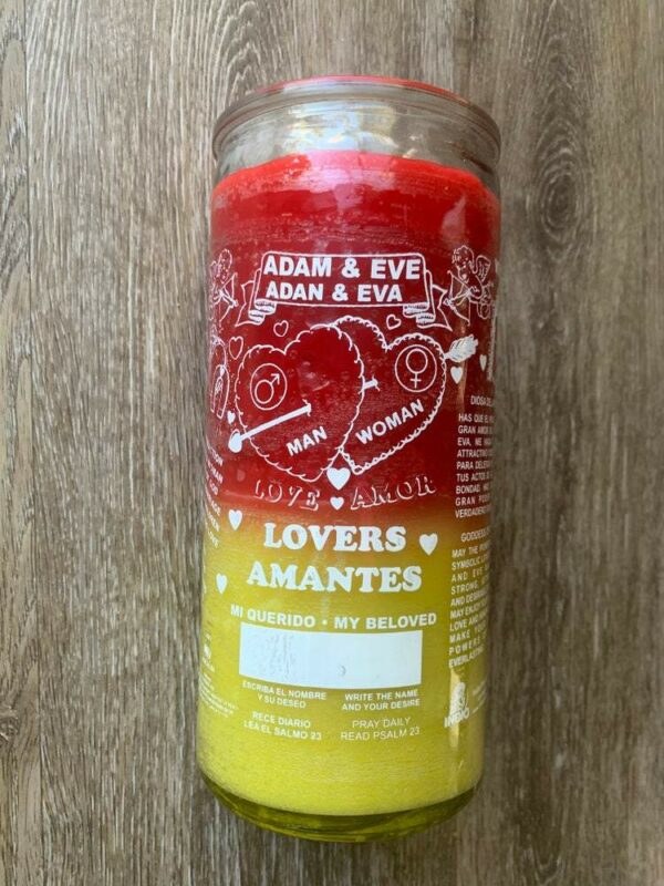 Red and yellow lovers candle with text.