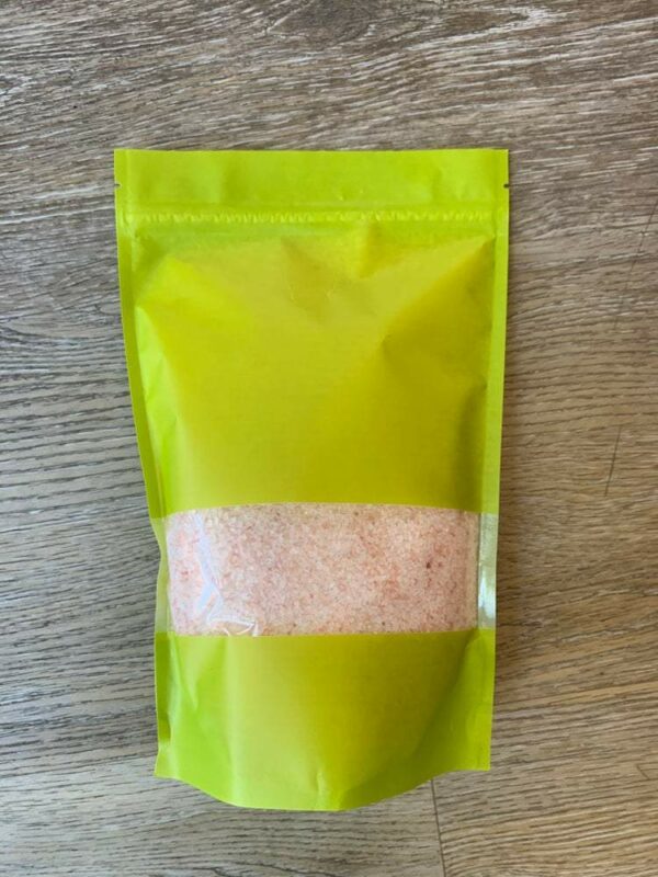 Pink Himalayan salt in a green bag.