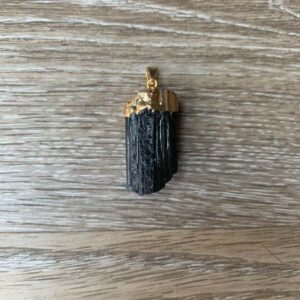 Black tourmaline crystal pendant with gold cap.