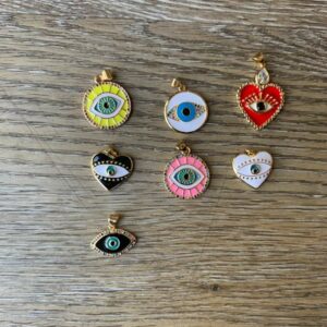 Assortment of evil eye charm pendants.