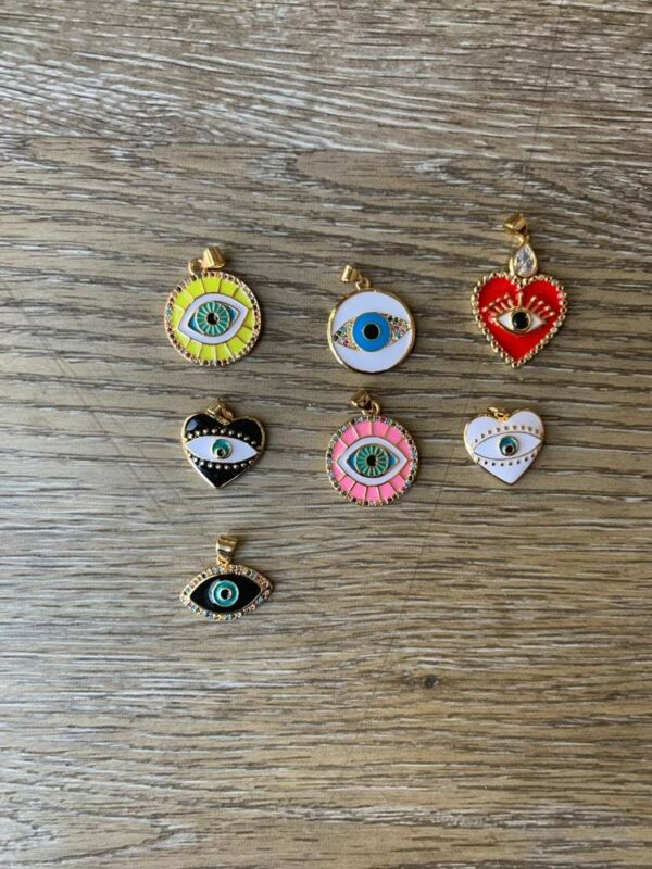 Assortment of evil eye charm pendants.