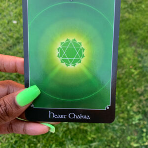 Green heart chakra card with a star