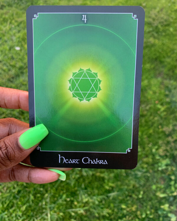 Green heart chakra card with a star