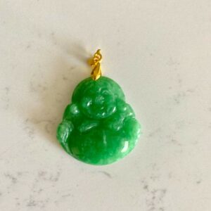 Green jade Buddha pendant with gold bail.