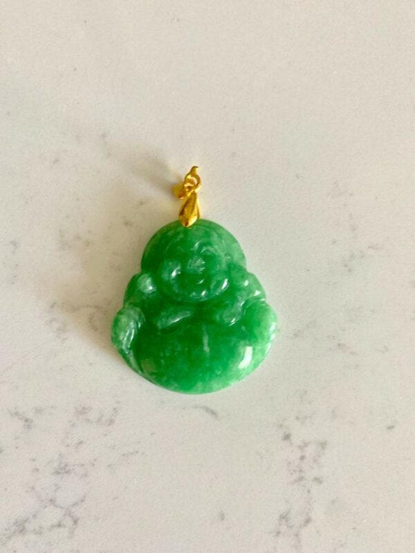 Green jade Buddha pendant with gold bail.