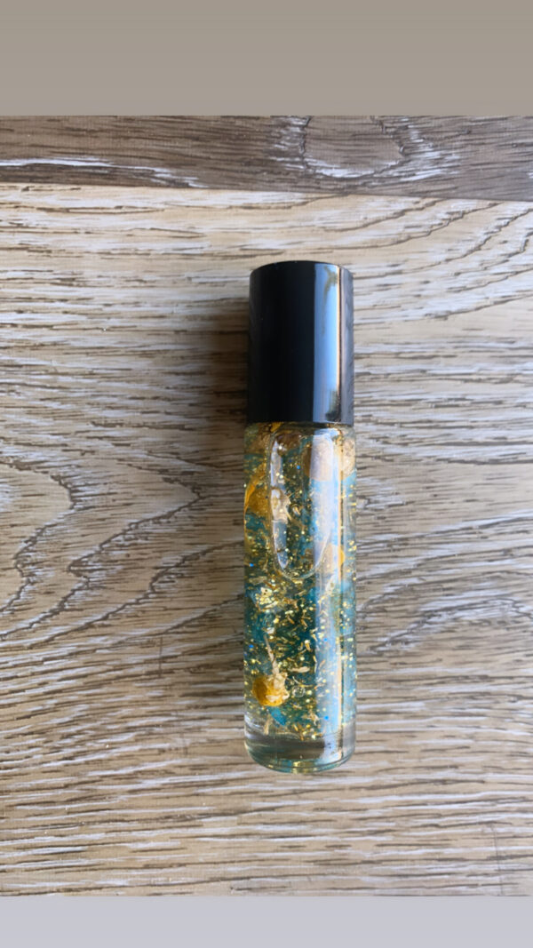 Gold glitter oil roller bottle.