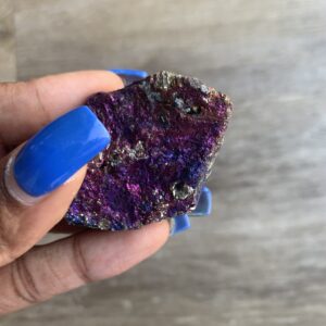 Purple and gold iridescent chalcopyrite crystal.