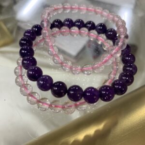 Amethyst and clear quartz bead bracelets.