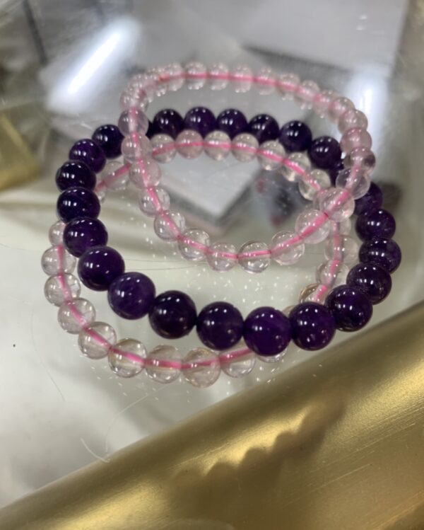 Amethyst and clear quartz bead bracelets.