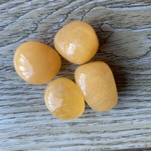 Four smooth, yellow, oval stones.