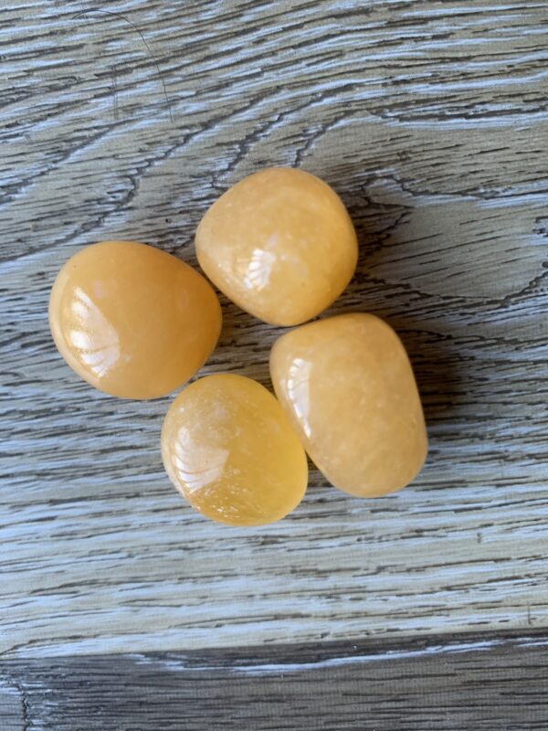 Four smooth, yellow, oval stones.