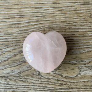 Pink heart shaped rose quartz crystal.