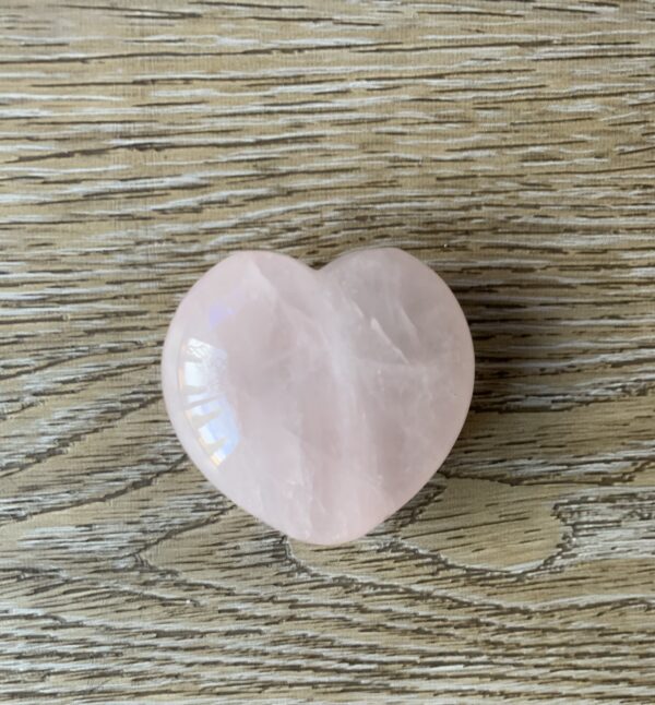 Pink heart shaped rose quartz crystal.