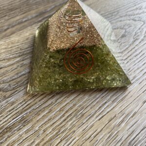 Green crystal pyramid with copper coil.