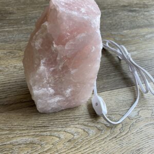 Pink crystal rock lamp with cord and switch.