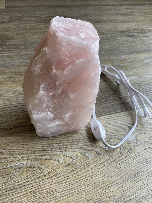 Pink crystal rock lamp with cord and switch.