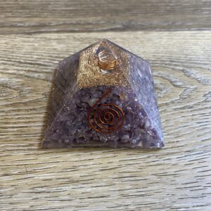 Amethyst crystal pyramid with gold flakes.