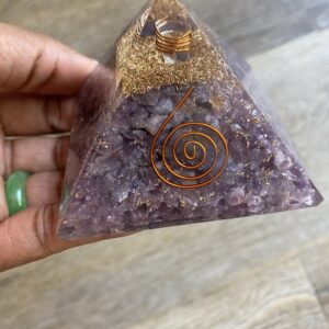 Amethyst crystal pyramid with copper wire.