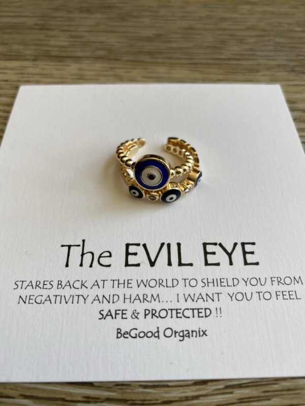 Gold evil eye ring with diamonds.