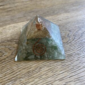 Green and gold crystal pyramid with wire.