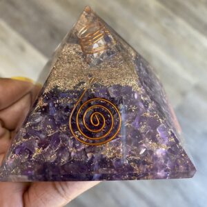 Amethyst crystal pyramid with copper wire.