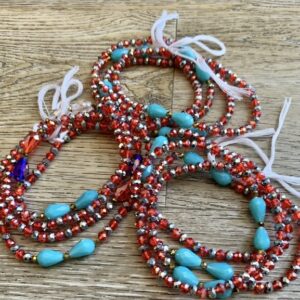 Red and turquoise beaded waist beads.