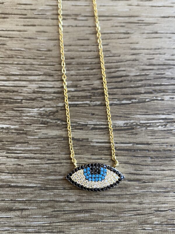 Gold chain with evil eye pendant.