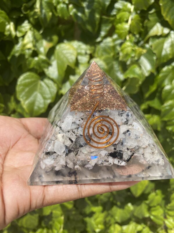 Crystal pyramid with copper wire.