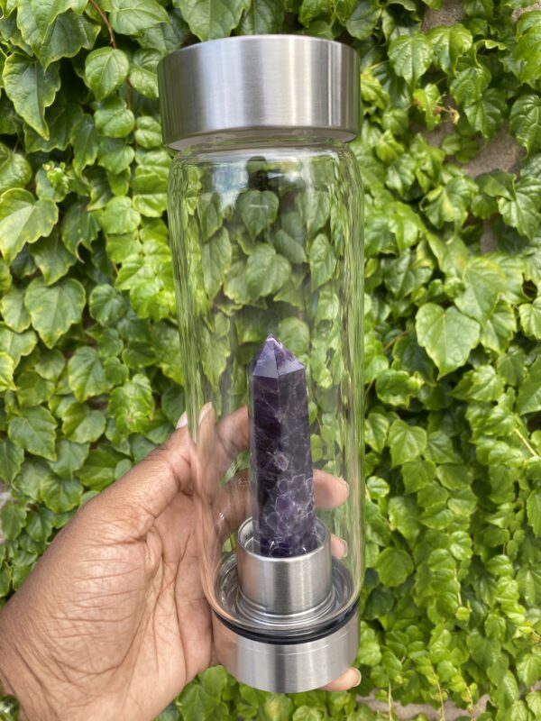 Amethyst crystal water bottle with a lid.