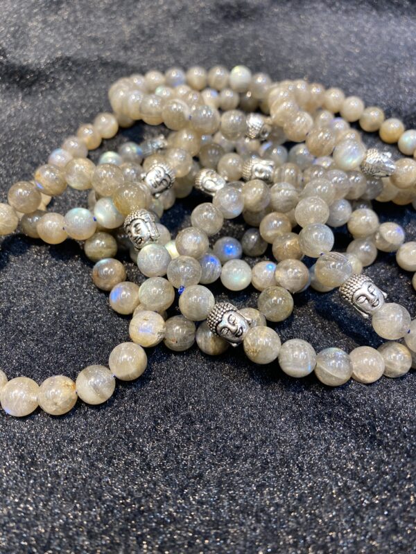 Gray gemstone bracelets with Buddha heads.