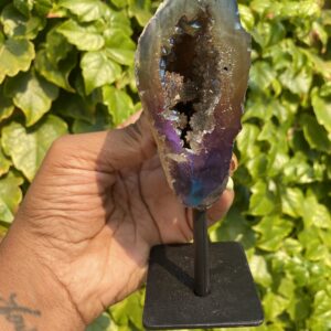 A geode with a purple and brown exterior.