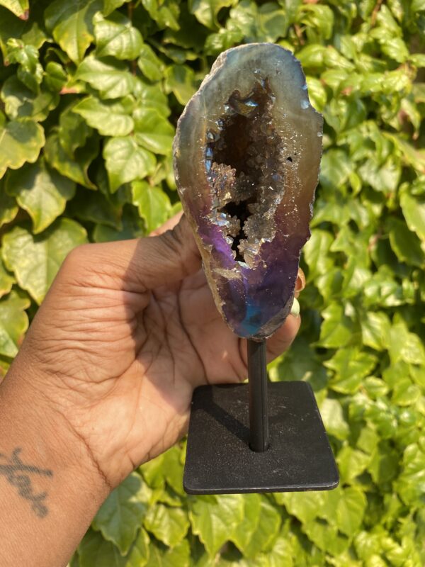 A geode with a purple and brown exterior.