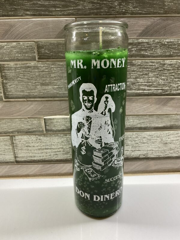 Green glass candle with Mr. Money design.