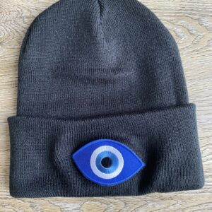 Black knit beanie with evil eye patch.