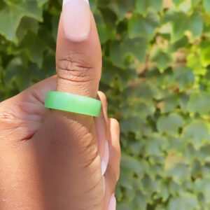 A person holding onto a green ring