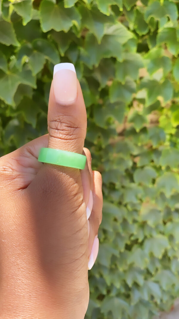 A person holding onto a green ring