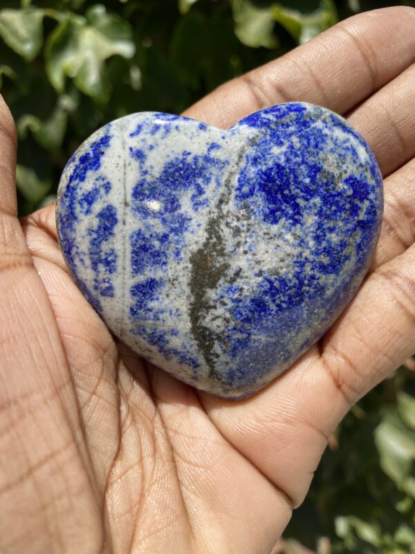 A person holding a stone in their hand