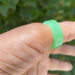 A person holding onto a green ring