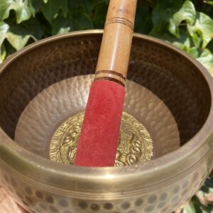 A red stick in the middle of a bowl