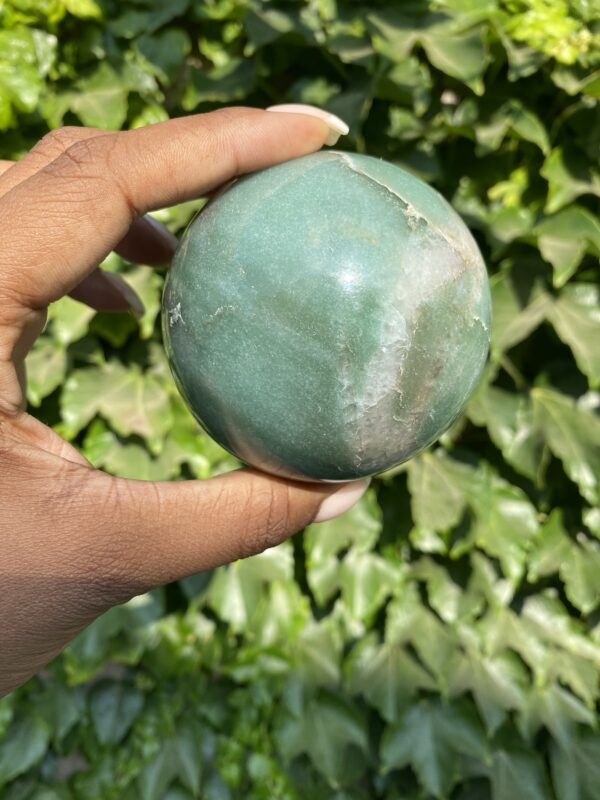 A person holding an apple in their hand.