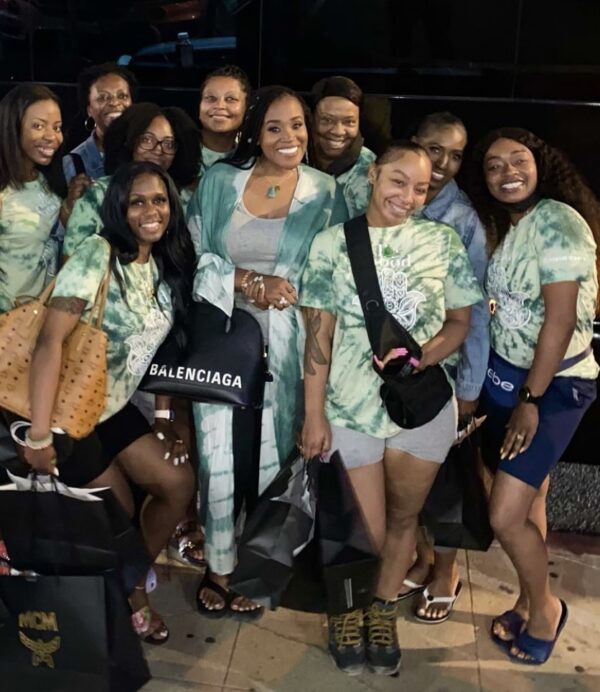 A group of women standing next to each other.