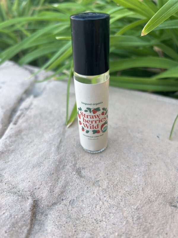 A bottle of lip balm sitting on top of a table.