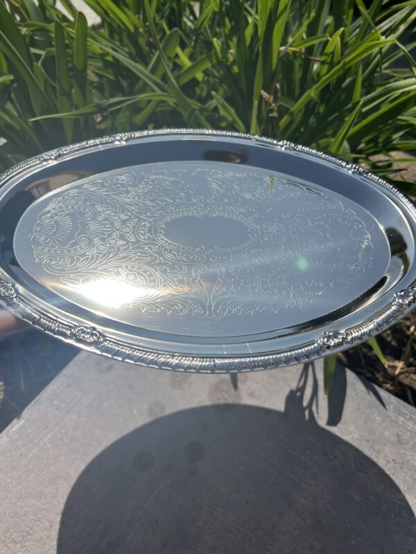 A silver tray sitting on top of a table.