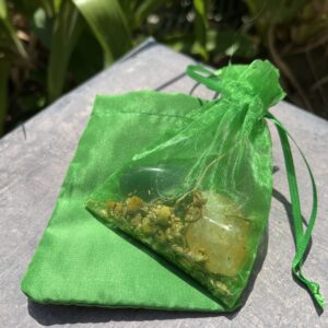 A green bag with some stuff inside of it