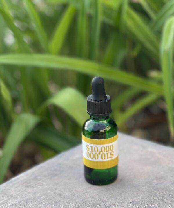 A bottle of cbd oil sitting on top of a table.