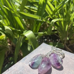 A close up of some earrings on the ground